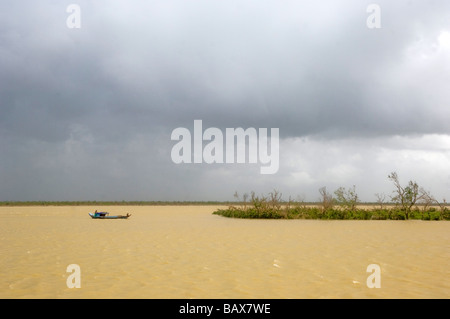 A boat on the river  destroyed village in Bogale after cyclone Nargis struck Myanmar between the 2nd and 3rd of May 2008 an Stock Photo