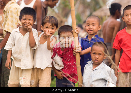 Children survivors play near destroyed village in the delta after Cyclone Nargis struck Myanmar between the 2nd and 3rd of May 2 Stock Photo