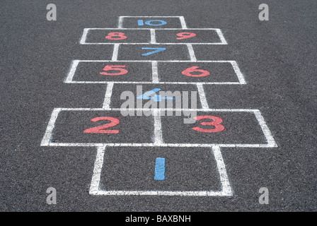 Numbers on a hopscotch grid on a playground floor Stock Photo