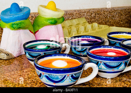Easter eggs being dyed in a Mexican kitchen. Stock Photo