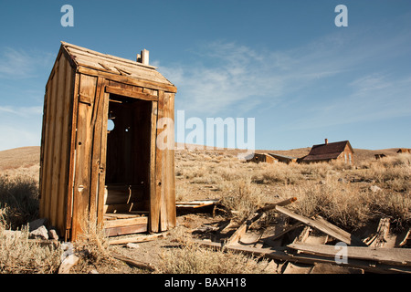 Abandoned outhouse in the ghost town of Bodie, CA Stock Photo