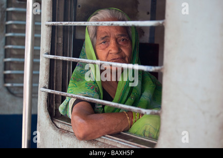 Elderly Woman on a Train at Agra Fort Railway Station in Agra India Stock Photo