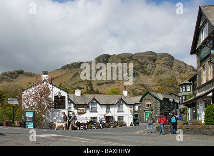 The Black Bull Hotel in Coniston village, against a backdrop of the Coniston fells, Lake District National Park, Cumbria UK Stock Photo
