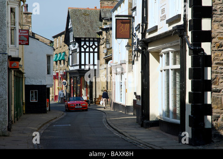 Red sports car on Main Street, Sedbergh, Cumbria, England UK Stock Photo