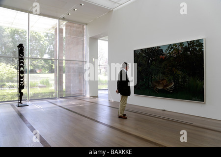 Person looking at a painting, artwork in Fondation Beyeler, Basel, Switzerland Stock Photo
