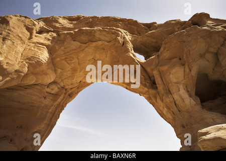 Natural picturesque erosive arch in hills from red sandstone Stock Photo