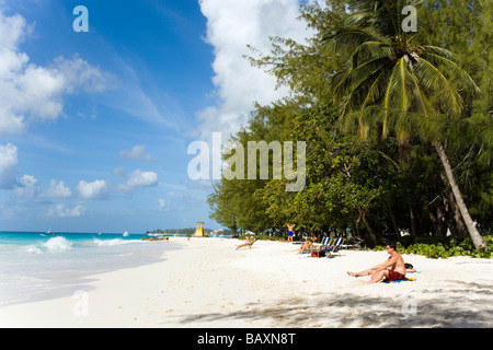 People sunbathing at Miami Beach, Oistins, Barbados, Caribbean Stock Photo