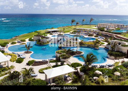 View over swimming pool area of the Crane Hotel, Atlantic Ocean in background, Barbados, Caribbean Stock Photo