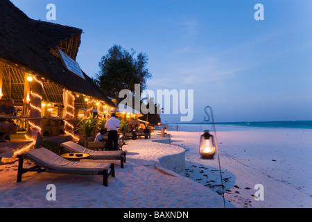 Sunlougers and beach bar in the evening, The Sands, at Nomad, Diani Beach, Kenya Stock Photo