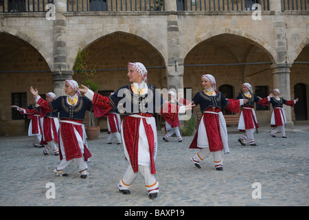 A group of female folk dancers in traditional costume, Buyuk Han, The Great Inn, Ottoman caravansary, Lefkosia, Nicosia, North C Stock Photo