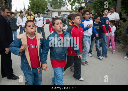 A group of boys taking part in an egg and spoon race at the Easter games, Kathikas, South Cyprus, Cyprus Stock Photo