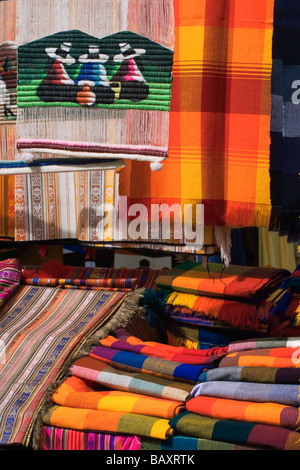 Brightly coloured locally woven hangings & fabrics at the famous market in Otavalo, Imbabura Province,Northern Highlands Ecuador Stock Photo