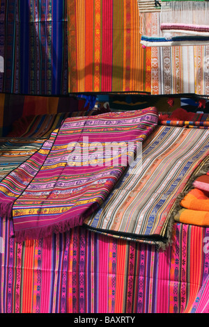 Brightly coloured locally woven fabrics at the famous market in Otavalo, Imbabura Province, Northern Highlands, Ecuador Stock Photo
