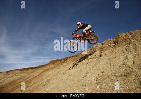 Motocross, motorcyclist during a jump Stock Photo