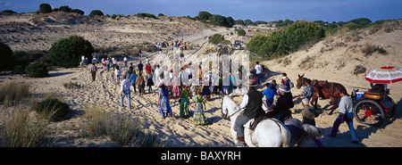 Pilgrims crossing the Donana National Park afoot and on horseback, Andalusia, Spain Stock Photo