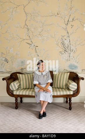Chambermaid in Churchill Suite des Reids Hotel, Funchal, Madeira, Portugal Stock Photo