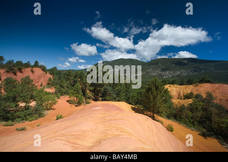 Colorado Provencal, rocks of ochre under a blue sky, Rustrel, Vaucluse, Provence, France Stock Photo