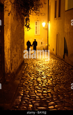 Couple walking down an alley, Mala Strana, Little Quarter, Prague, Czech Republic Stock Photo