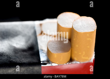A pack of cigarettes isolated on a black background Stock Photo