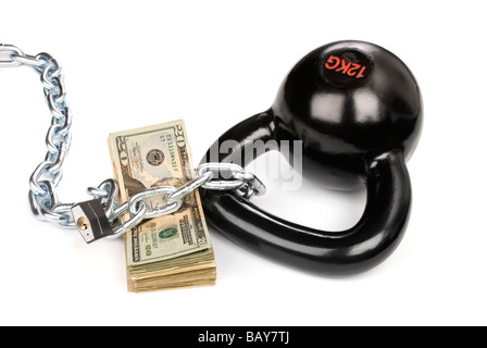 A stack of cash sits well protected while secured with a padlock and ball and chain Stock Photo