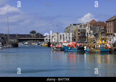 View of Weymouth Harbour in Dorset, England, on a sunny day.