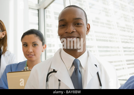 Multi-ethnic doctor and nurse looking confident Stock Photo