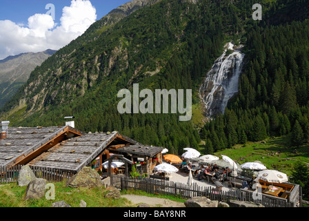 alpine hut Grawa Alm with waterfall Grawa Wasserfall, Grawaalm, Grawafall, Stubaier Alpen range, Stubai, Tyrol, Austria Stock Photo