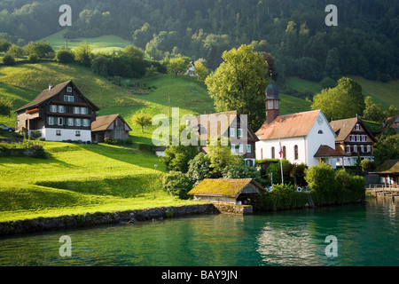 View over Lake Lucerne to Kehrsiten Dorf with church, Canton of Lucerne, Switzerland Stock Photo