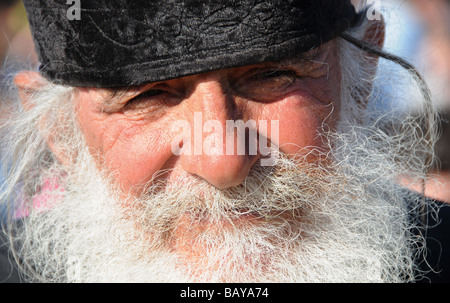 Portrait of a priest at the annual mass-baptism on the River Jordan in Israel. Stock Photo