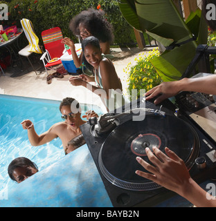 Multi-ethnic group of friends enjoying pool party Stock Photo