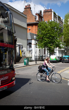 A cyclist riding in a London bus lane Stock Photo - Alamy