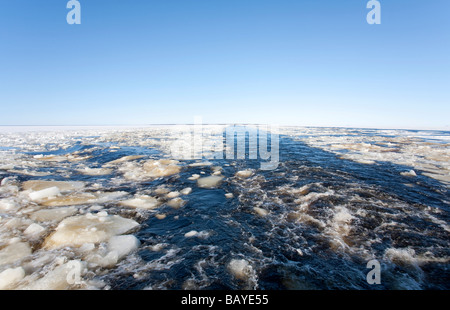 Breaking ice on ship's wake at Baltic Sea , traveling from Hailuoto Island at Gulf of Bothnia , Finland Stock Photo