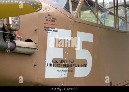 Markings on the fuselage of a WW2 era Piper L4-J spotter or light transport plane. Stock Photo