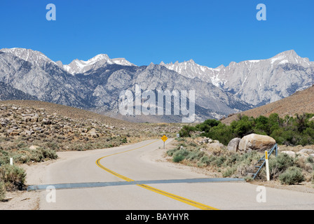 Lubken Canyon Road and Mount Whitney, distant peak in the center, Hwy 395 eastern Sierras near Lone Pine and Olancha California Stock Photo