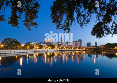 Downtown skyline of Orlando Florida reflects in Lake Lucerne at sunset Stock Photo