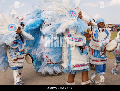 Mardi Gras Indians parading in their costumes at the New Orleans Jazz & Heritage Festival. Stock Photo