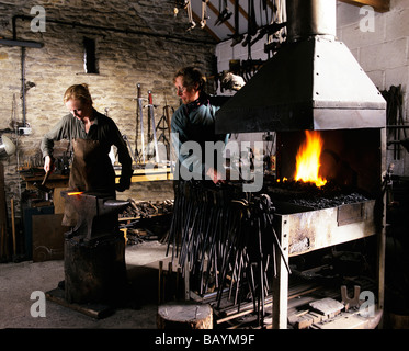 Blacksmiths in forge with furnace Stock Photo