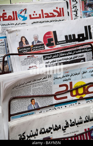 Rack of Arabic Moroccan newspapers, for sale in the Medina at Fes. Including Almassae and Annahar Al Maghribia. Press, daily Stock Photo