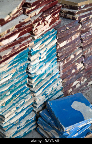 Piles of hand made ceramic tiles, stored ready to be cut up for mosaics. Used on tables, walls, fountains, details Stock Photo