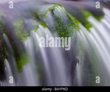 Cascading water in a small waterfall in Exmoor National Park Devon England January 2009 Stock Photo