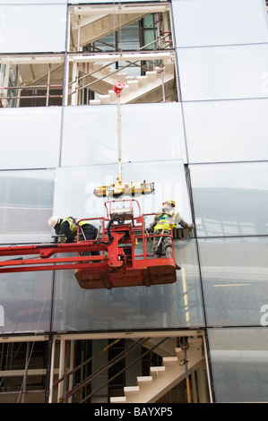 London Hackney May 2009 Installing large windows in new council building Stock Photo