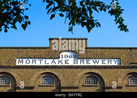 the name mortlake brewery and the date 1869 on a brick building in mortlake, southwest london, england Stock Photo