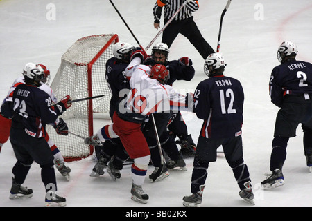 Fight in a U18 ice-hockey game between USA and Russia. Stock Photo