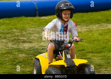 Young Boy Child Youngster Riding a Quad Bike Stock Photo