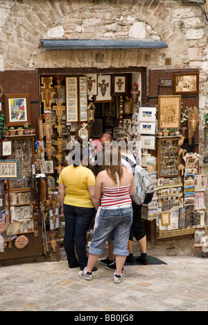 three girls buying souvenirs in Assisi Stock Photo