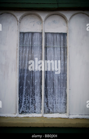Skinny double window in a house in Cobh Ireland Stock Photo