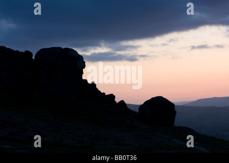 Sunset at the Cow and Calf rocks, a famous Yorkshire landmark on Ilkey Moor above Ilkey, West Yorkshire Stock Photo