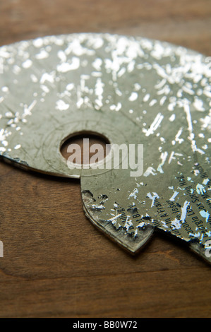 Battered and broken compact disc Stock Photo