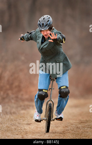 Girl on unicycle Stock Photo