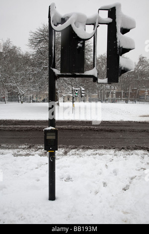 Pedestrian crossing covered in snow London Stock Photo